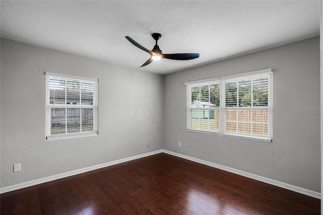 spare room with hardwood / wood-style flooring and ceiling fan