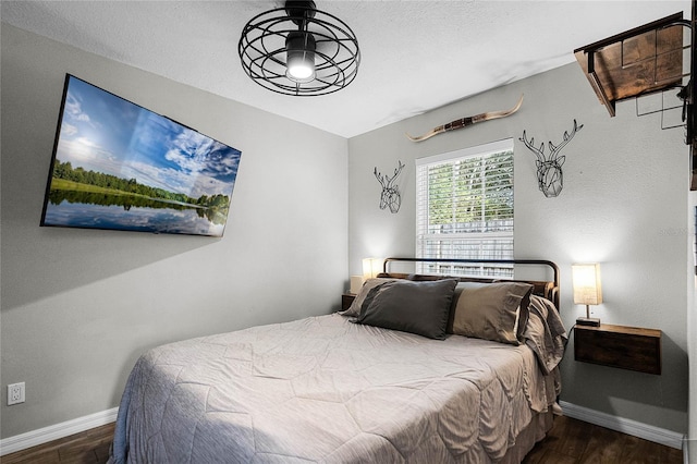 bedroom featuring dark hardwood / wood-style floors