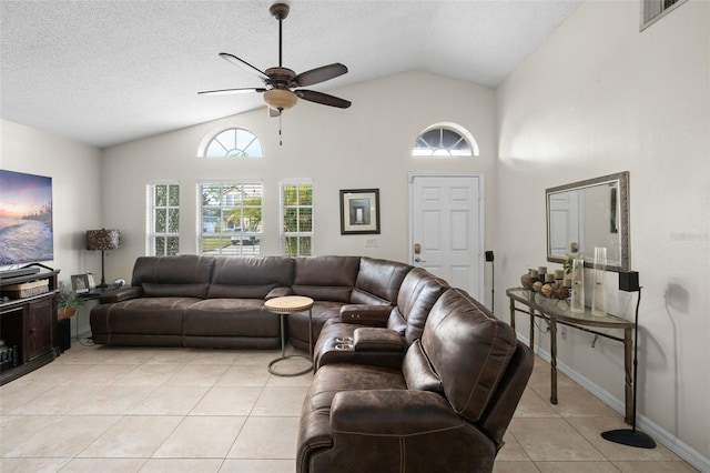 living room with lofted ceiling, light tile patterned floors, a textured ceiling, and ceiling fan