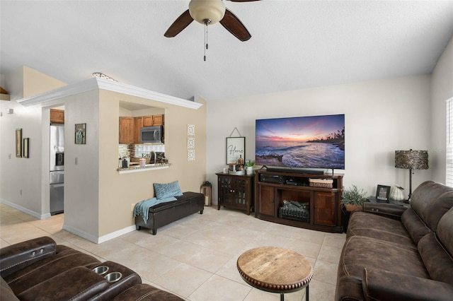 tiled living room featuring vaulted ceiling and ceiling fan