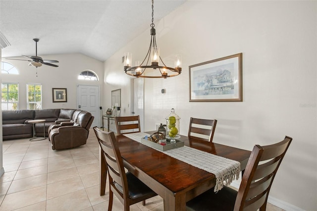 tiled dining room featuring ceiling fan and high vaulted ceiling