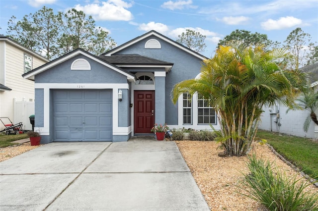 ranch-style home featuring a garage