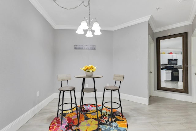 dining room featuring ornamental molding and a chandelier