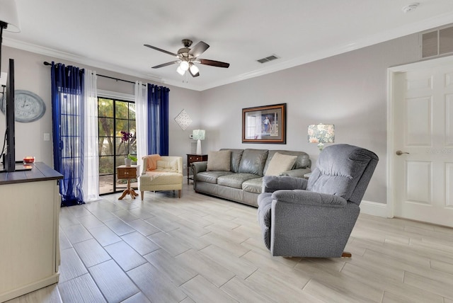 living room featuring crown molding and ceiling fan