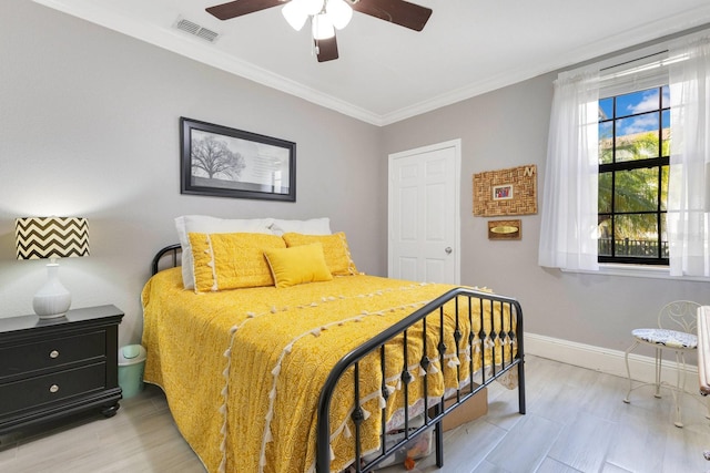 bedroom featuring crown molding and ceiling fan