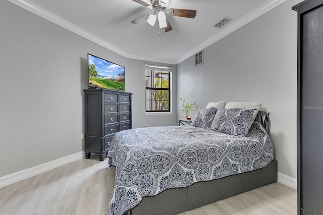 bedroom featuring crown molding, ceiling fan, and wood-type flooring