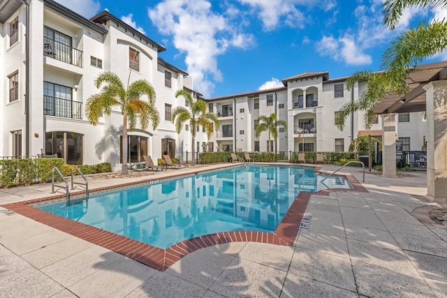 view of swimming pool with a patio area