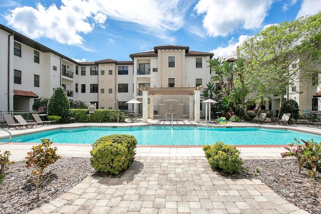 view of pool featuring a pergola and a patio area