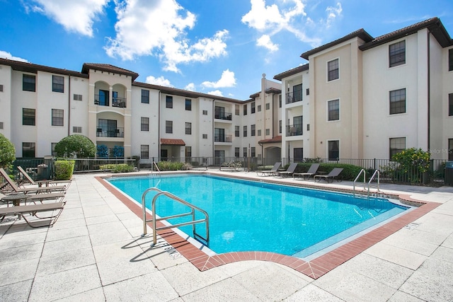 view of pool featuring a patio