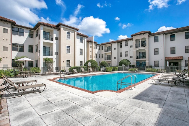 view of swimming pool with a patio area