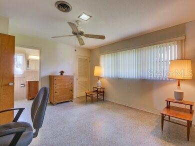 office space with ceiling fan