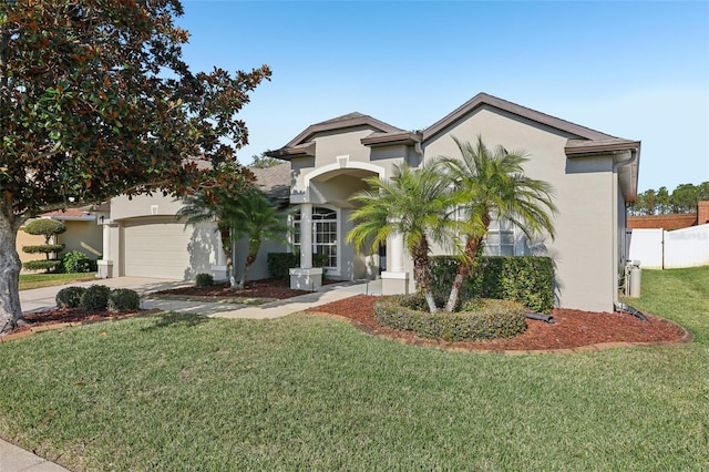 view of front of house featuring a garage and a front yard