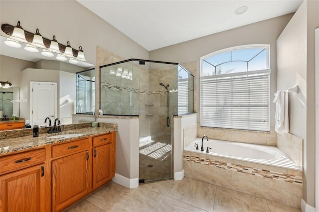 bathroom with vanity, lofted ceiling, and shower with separate bathtub