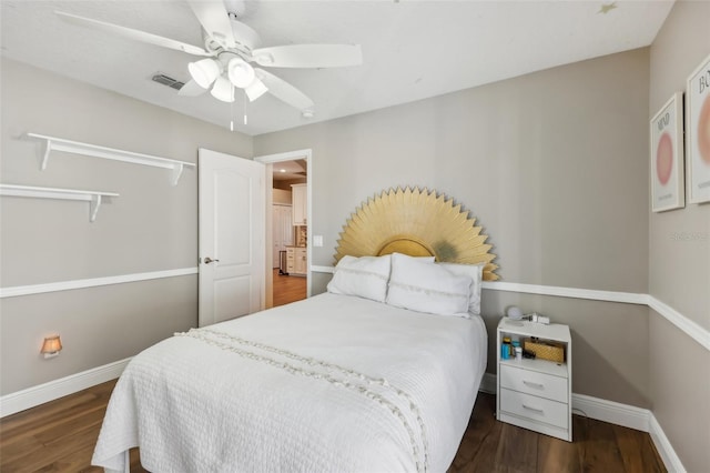 bedroom featuring ceiling fan and dark hardwood / wood-style floors