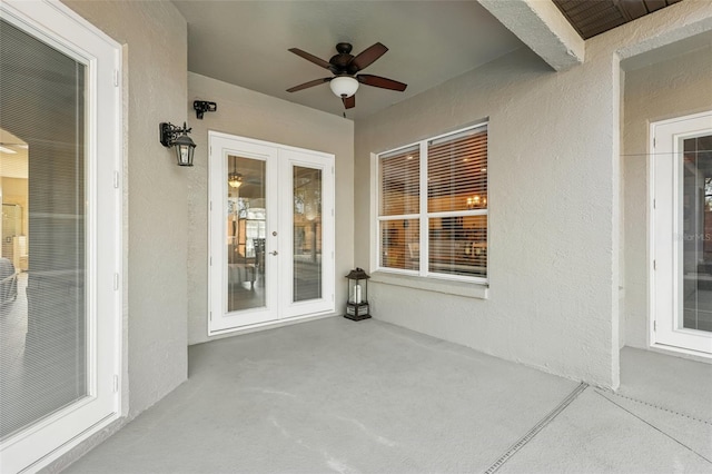 view of patio with french doors and ceiling fan