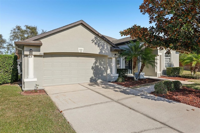 single story home with a garage and a front yard