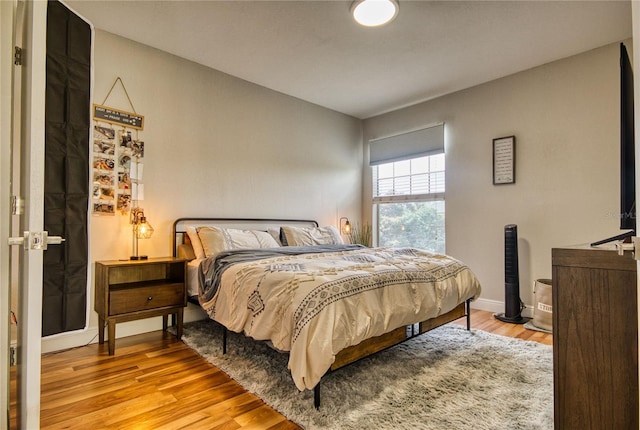 bedroom with light hardwood / wood-style floors