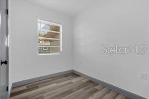 unfurnished room featuring wood-type flooring