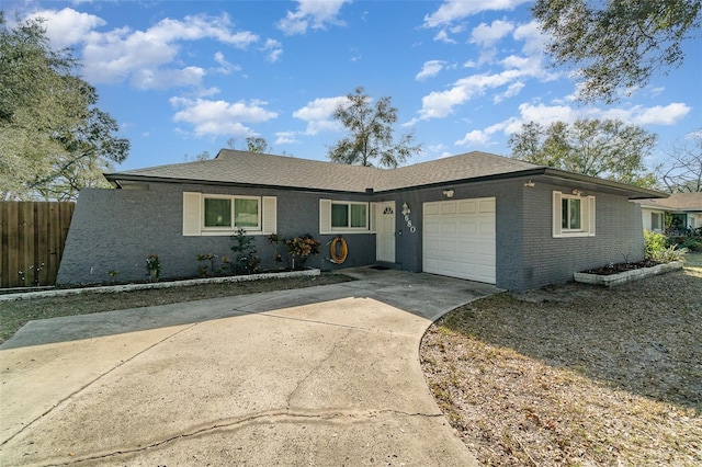 ranch-style house featuring a garage