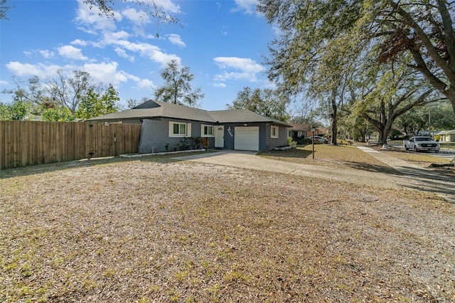 ranch-style house featuring a garage