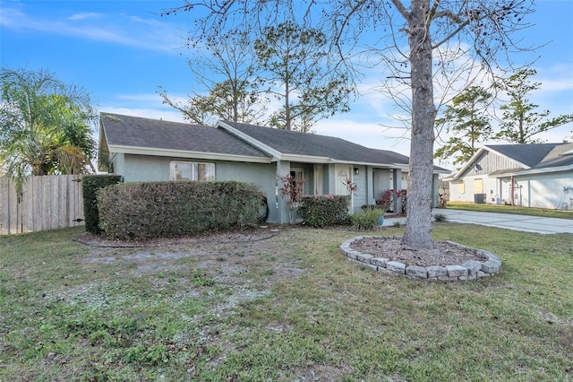 ranch-style house featuring a front yard