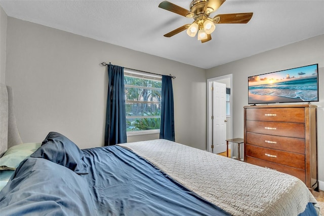 bedroom featuring ceiling fan and a textured ceiling