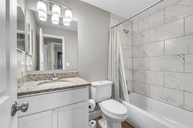 full bathroom featuring vanity, shower / bath combo, and toilet