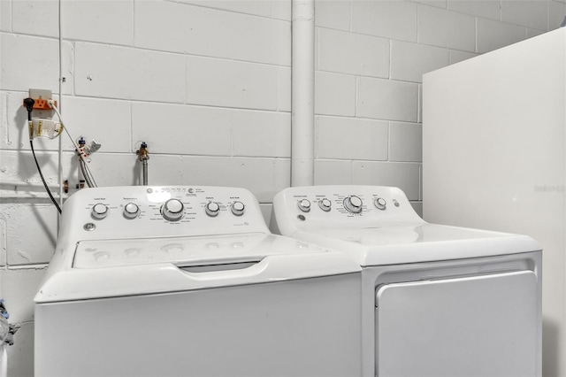 laundry room featuring washing machine and clothes dryer