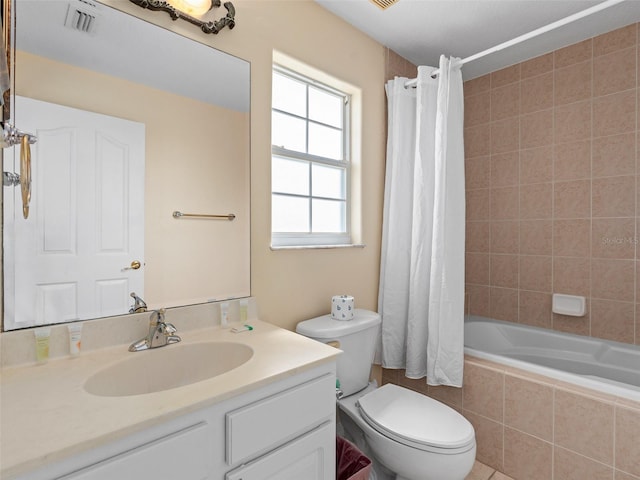 full bathroom with shower / bath combo, vanity, and toilet