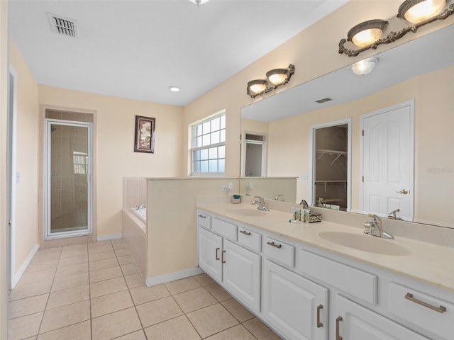 bathroom featuring tile patterned floors, vanity, and independent shower and bath