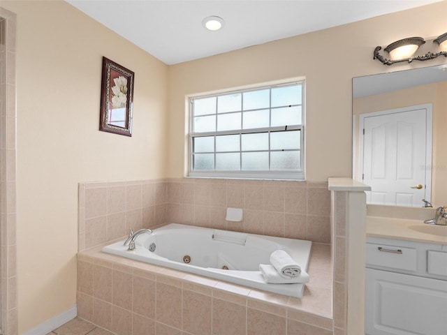 bathroom with vanity, tile patterned floors, and tiled bath