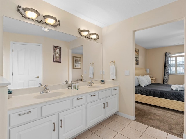 bathroom featuring tile patterned flooring and vanity