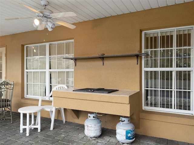 view of patio / terrace featuring ceiling fan