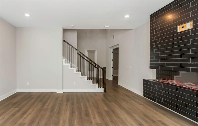 interior space featuring a fireplace and wood-type flooring