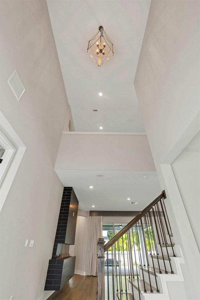 staircase with hardwood / wood-style flooring