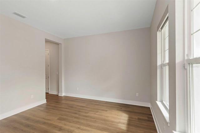 spare room featuring hardwood / wood-style floors