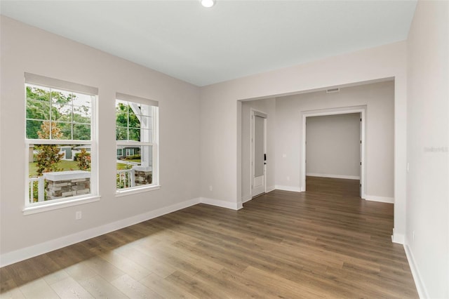 spare room featuring dark hardwood / wood-style flooring