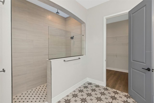 bathroom with a tile shower