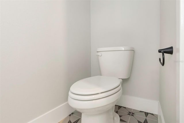 bathroom with tile patterned floors and toilet