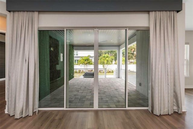 entryway with hardwood / wood-style floors