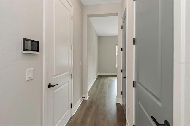 hall with dark hardwood / wood-style floors