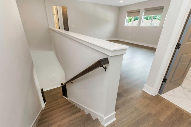 stairway featuring hardwood / wood-style flooring