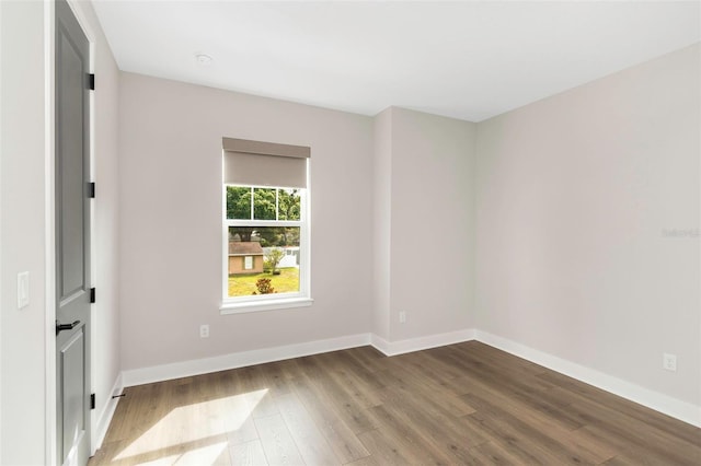 unfurnished room featuring wood-type flooring