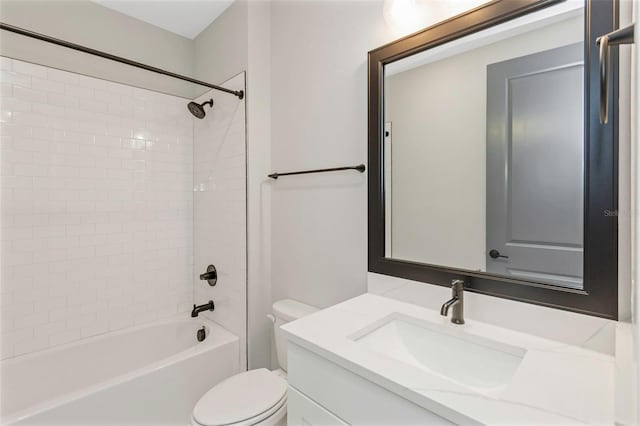 full bathroom featuring vanity, toilet, and tiled shower / bath combo