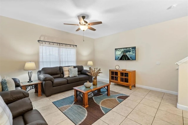 living room with ceiling fan and light tile patterned floors