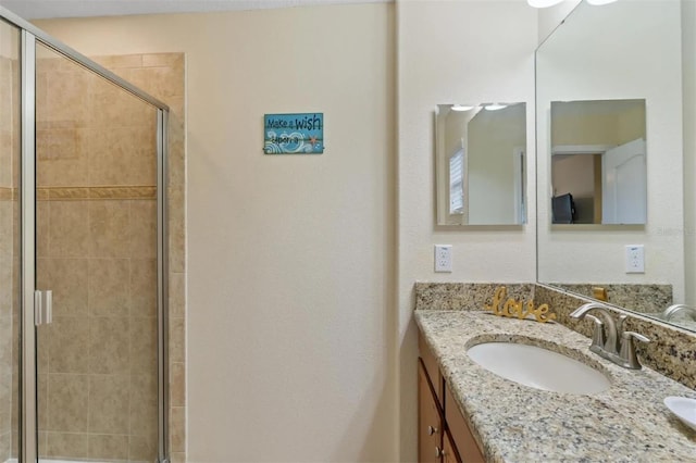 bathroom with vanity and an enclosed shower