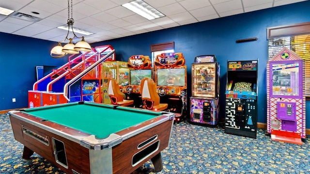 game room featuring carpet floors and a drop ceiling