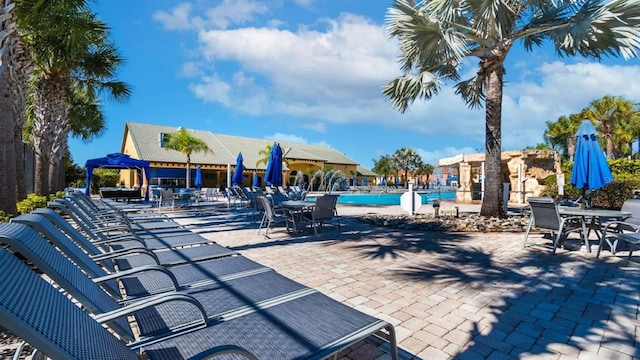 view of patio / terrace featuring a community pool