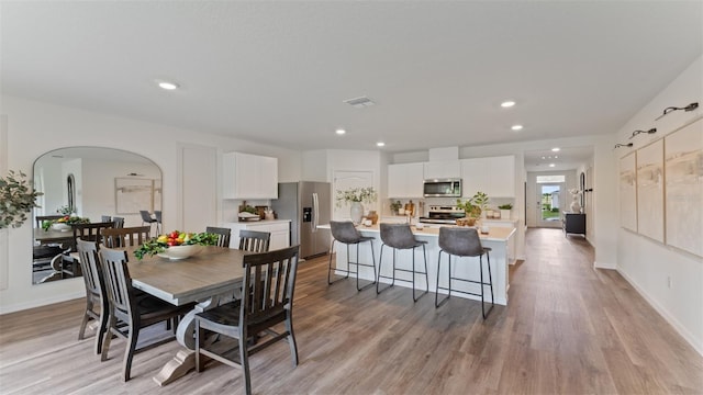 dining space featuring light hardwood / wood-style floors