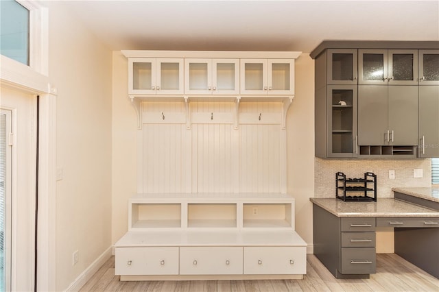 mudroom with light hardwood / wood-style flooring